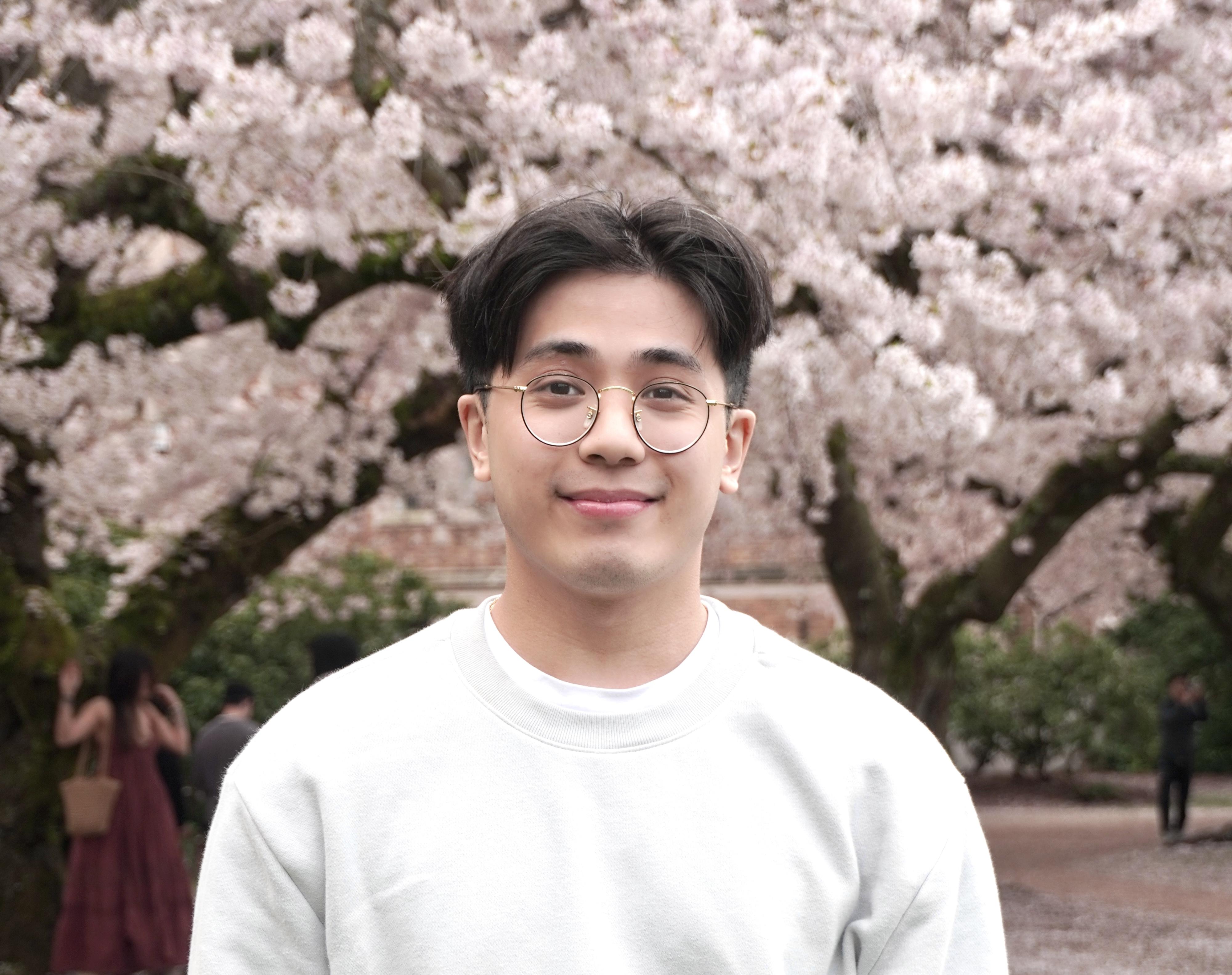 David Pham smiling in a suit